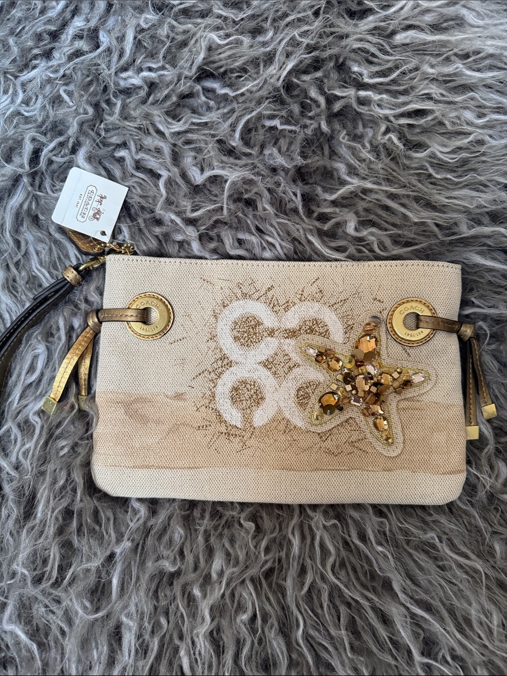 Coach Beige Canvas Wristlet with Gold Sequin Starfish